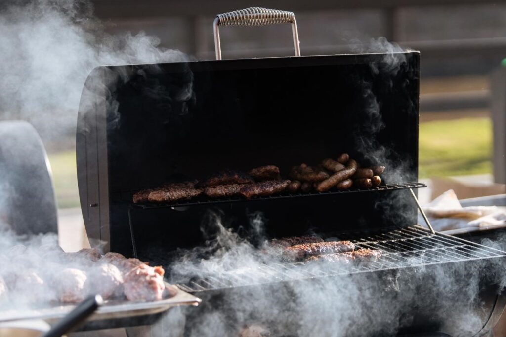 Pellet grill with matching protective cover on backyard patio